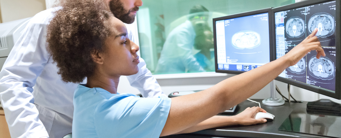 Healthcare workers examining x-ray images